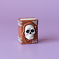 Spellbook with Skull Face Spooky Halloween Fidget Clicker with Wrist Strap or Keychain