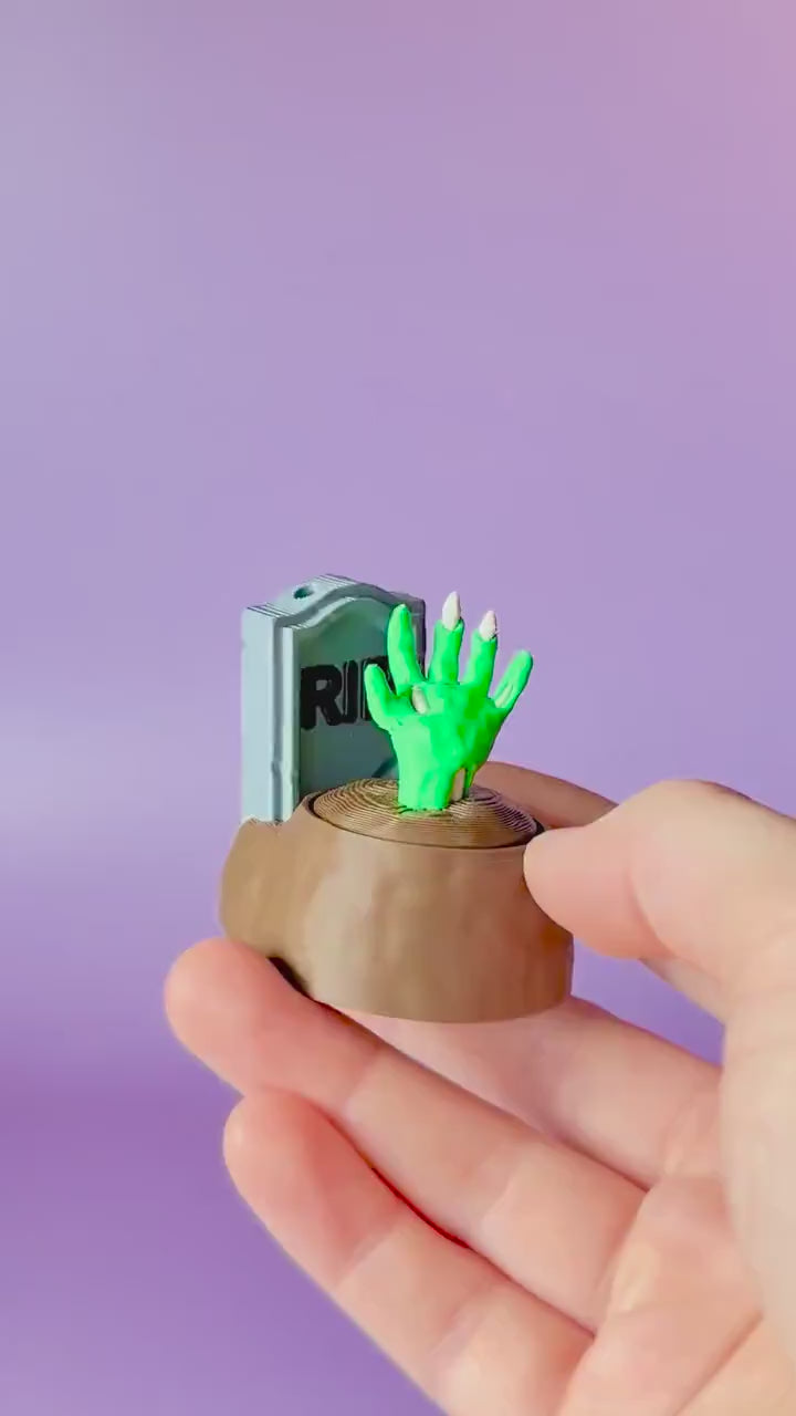 Zombie Hand in Grave Spooky Halloween Fidget Clicker with Wrist Strap or Keychain